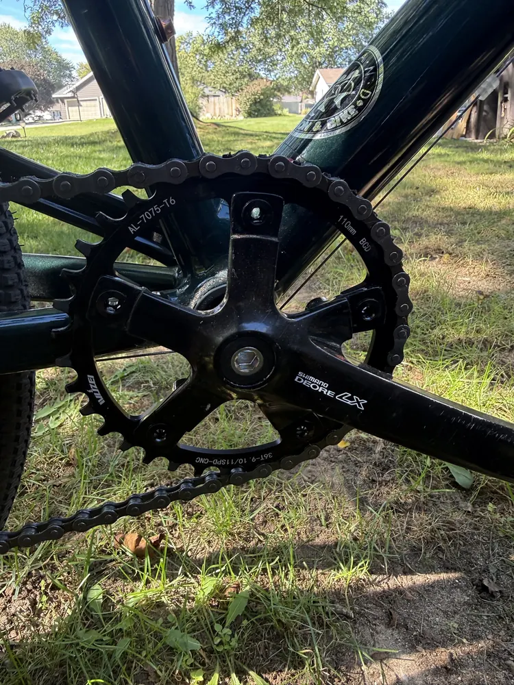 Shimano Deore LX crank arm with a single black 36-tooth chainring.