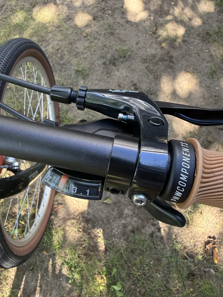 Shimano SL-M315 trigger shifter with gear window next to the brake lever.